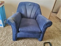 Blue Comfy Chair has wear