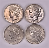 Four 1922 Peace silver dollars