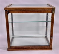 Oak counter top display case; glass on all sides,