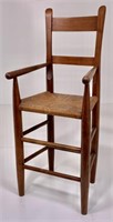 Walnut clore youth chair, string rush seat, arms