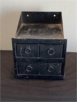 Black metal four drawer small cabinet