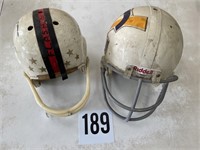 Pair of vintage football helmets