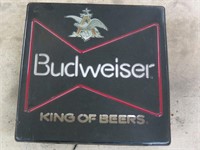 Lighted Budweiser beer sign