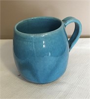 Deichmann mug in blue, 4” tall.