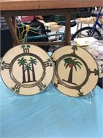 Two metal decorative hanging plates