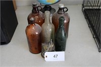 Group of Anique Bottles and Cow Bell