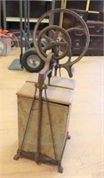 Vintage metal butter churn on stand
