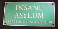 Green cast iron Insane Asylum sign