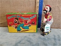 MECHANICAL CLOWN ON ROLLER SKATE TIN TOY W/