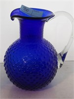 Blue glassware vase with clear blown glass handle
