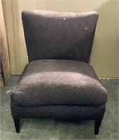Slipper chair in brown and black boucle fabric