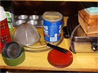 Contents of 2 shelves only- baking pans, tins,