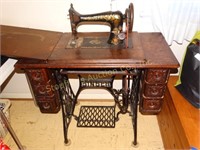 Vintage Singer Treadle Sewing Machine in cabinet