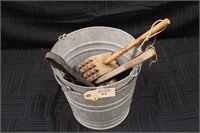 Set of glavanized buckets and primitive tools