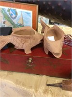 Two carved wood fish planters
