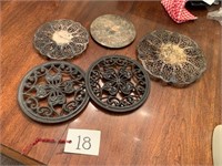 SILVER AND CAST IRON TRIVETS