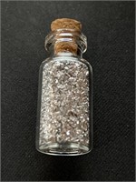 Glass Jar of Silver Flakes