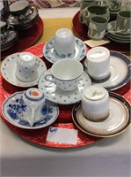 Set of six different tea cups and saucers