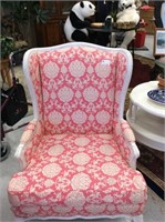 Pink and white wing back chair