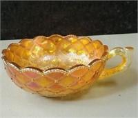 Stunning peach carnival glass dish with handle