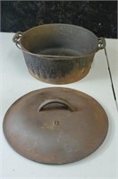 Carlisle Cast iron Dutch oven marked 8 approx 10