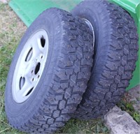 Pair of LT225/75R16 studded snow tires on GM 6 lug