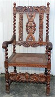 Ornate Carved  Arm Chair with cane seat