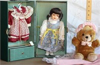 Doll in wardrobe case with extra dress, bear