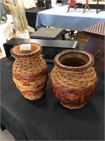 Set of two pottery and wicker vases