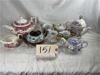 Various teapots and creamers