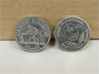 TWO COMMEMORATIVE COINS, CALGARY STAMPEDE DOLLAR