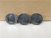 THREE CANADIAN FIFTY CENT COINS