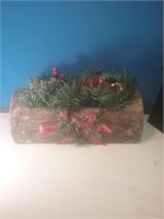 Holiday log decor with Greenery and a candle