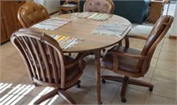 Drop leaf 48 in round table with rolling chairs