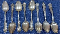 12 Ornate and collector silverplate spoons