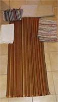 5 braided rugs in foyer