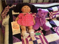 Cabbage patch doll & purple teddy bear