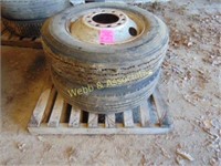 2 spare tires with rims, one 28S 75 24.5,