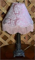 Ornate cast metal boudoir lamp with pink beaded sh