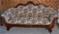 Carved walnut and upholstered formal sofa