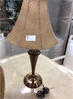Copper colored lamp base with faux ostrich shade