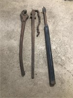 Pipe tongs and hammer spike.