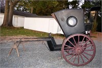 Horse drawn two wheel enclosed carriage with an el