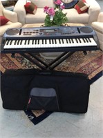Yamaha electric keyboard with stand and bag