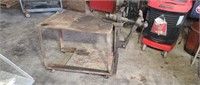 Steel welding table with old black Smith leg vice