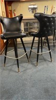 2 black vinyl barstools