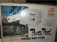 new porta potty in box