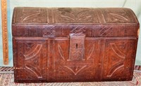 Early small wood trunk covered in tooled leather,