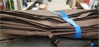 Brown canvas outdoor tarp with locking clips