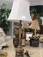 Tall brown candlestick lamp with linen shade